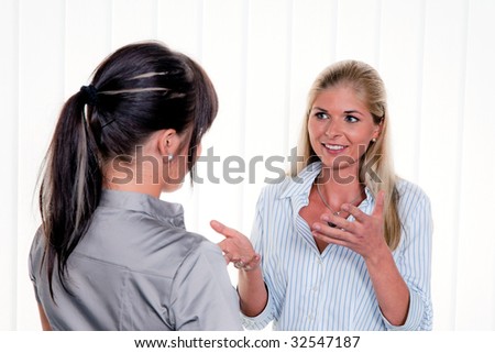 Two women in conversation at the office