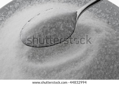 Fine granulated sugar on a spoon