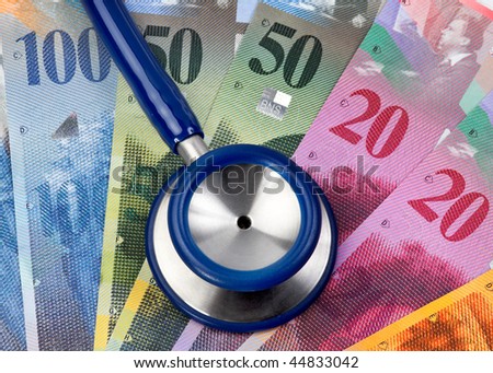 Swiss Franc and stethoscope, symbol of health costs