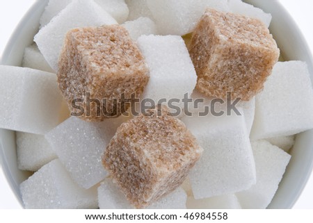 White and brown sugar. Unhealthy diets with carbohydrates