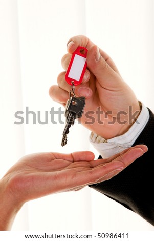 Successful real estate broker with a house key