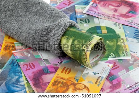 A piggy bank with money bills Swiss Franc
