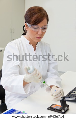 A woman in laboratory research. Research in the research laboratory.