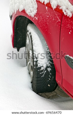 Winter tires of a car in the snow. Driving in the winter.