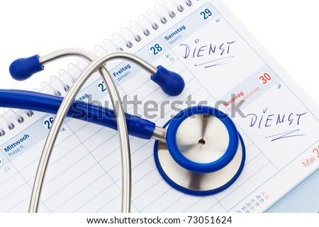 Stethoscope and a calendar. Doctor\'s appointment and service in the hospital.