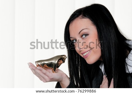 Woman with a bull stock symbol. Gains in share prices.