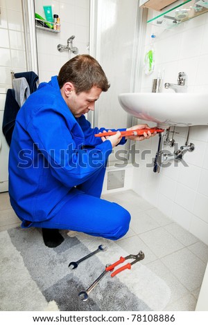 A plumbing repair a broken sink in bathroom