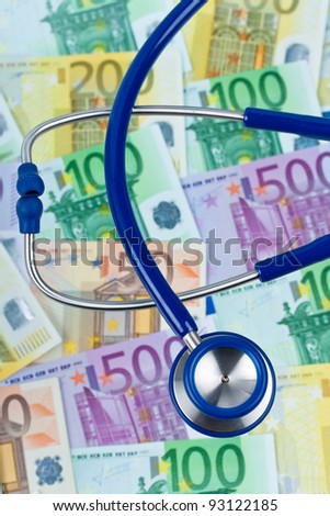 many euro bank notes with a stethoscope. health costs.
