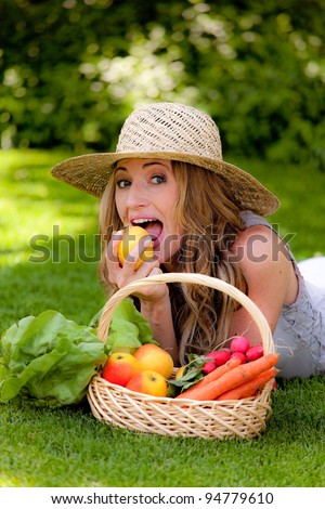 fruits and vegetables in the basket with his wife. vitamins from your own garden
