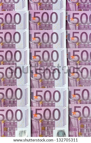 many five hundred euro banknotes lie side by side. symbolic photo for wealth and investment