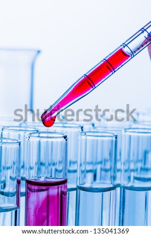 many test tubes in a test in a research laboratory of a university. symbol photo and learn for research.