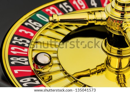 the cylinder of a roulette gambling in a casino. profit and loss is decided by chance.