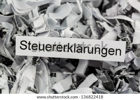 tagged with shredded paper tax returns, symbolic photo for tax burden and storage requirement
