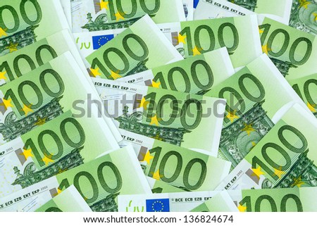 many einhhundert euro banknotes lie side by side. photo icon for wealth and investment