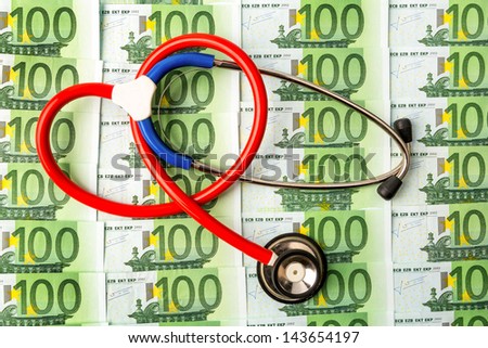 stethoscope and euro bills. symbol photo for costs in health care and health insurance and medical