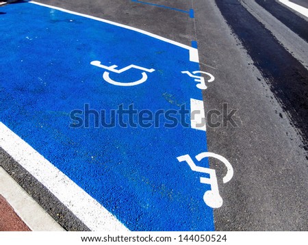 parking lot for wheelchair driver. disabled parking space in a city.