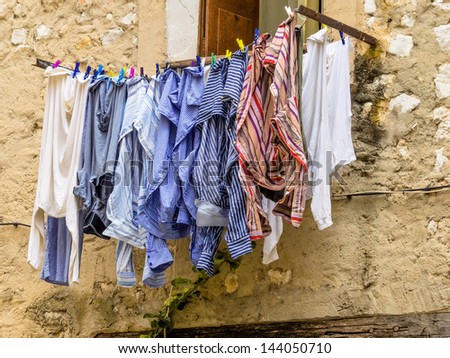washing on the line in front of a window