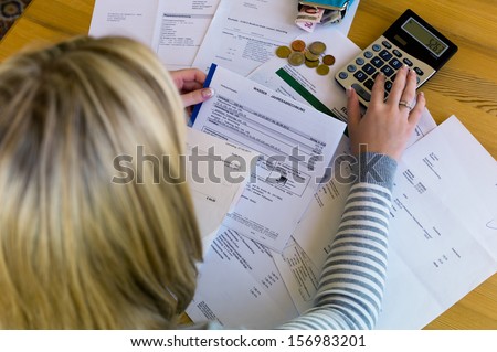 a woman with unpaid bills has many debts. unemployment and personal bankruptcy