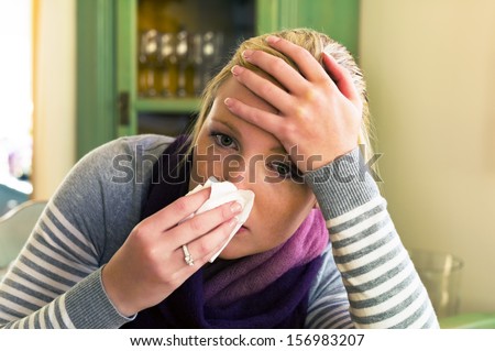 woman on sick leave with a handkerchief. symbolic photo for cold, cold and flu season
