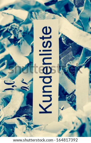 shredded paper tagged with customer lists, symbol photo for customer data and data protection