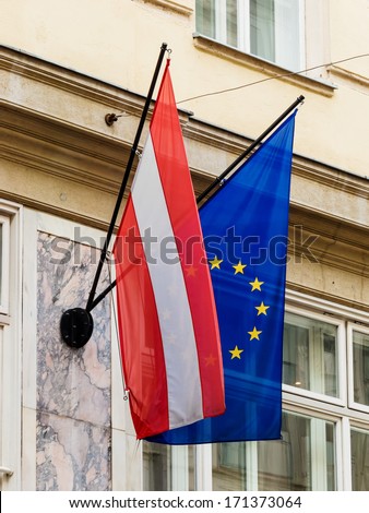 the european union (eu) flag and the austrian flag.