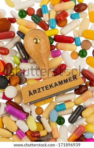 stamp on colorful tablets, symbol photo for doctors chamber, medical profession and patients\' rights