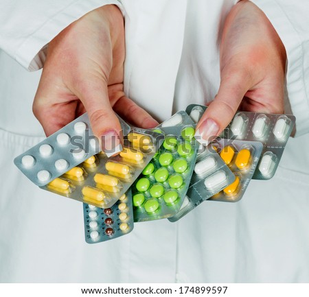a young doctor prescribes medication. prescription pills are prescribed by the doctor.