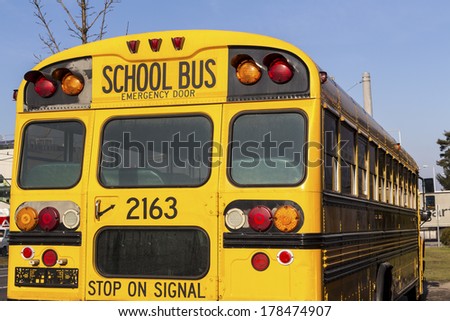 a typical american school bus in yellow color