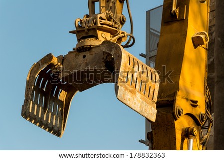 excavator on a construction site during the demolition of a hauses.platz for new housing and living space is required