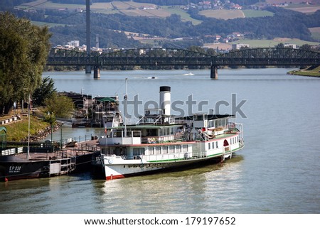 the capital of upper austria in austria is linz. an old steam boat on the danube