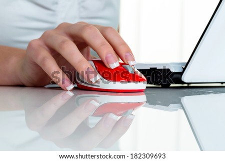 woman in office with computer mouse. correct posture