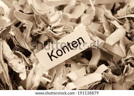 shredded paper tagged with accounts, symbol photo for finance, accounting and double-entry bookkeeping