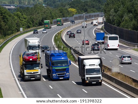 trucks on a three-lane motorway. symbolic photo for transport of goods
