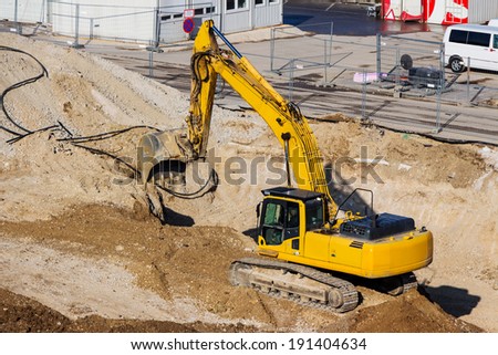 excavator on a construction site. excavator bucket with soil, ground work.
