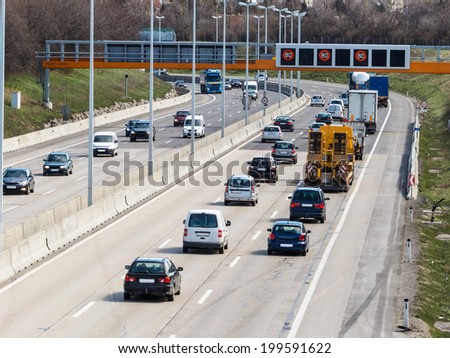 cars on a highway with a speed limit icon photos of transport, mobility, environmental protection