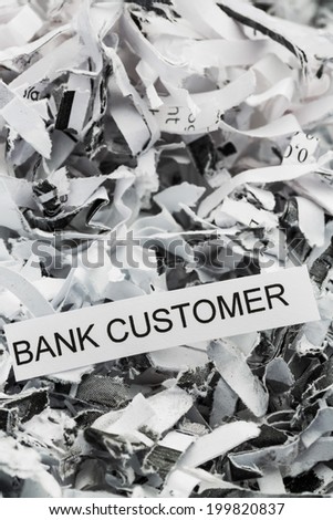 shredded paper tagged with bank customer, symbol photo for data destruction, customer data and banking secrecy