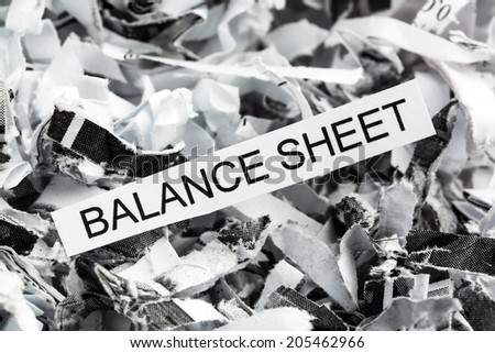 shredded paper tagged with balance sheet, symbol photo for data destruction, budgets and accounting