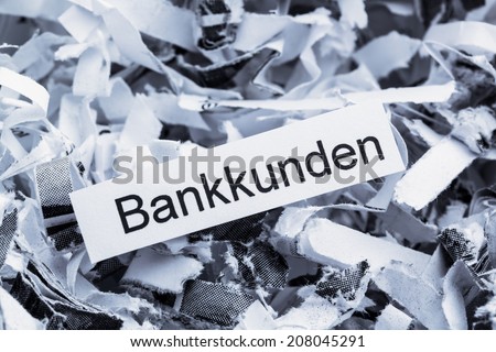 shredded paper tagged with bank customers, symbol photo for destruction of data, customer data, and bank secrecy