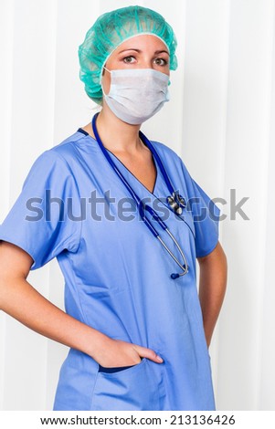 a nurse or doctor in surgical clothes before surgery. symbol photo for work in the hospital