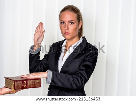 a woman says as a witness in court in a lawsuit. is sworn in and swears on the bible.