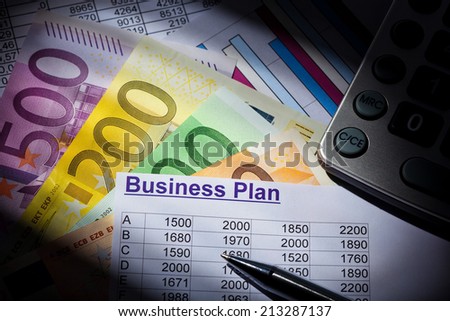 a business plan for starting a business. ideas and strategies for business creation. euro banknotes and calculator