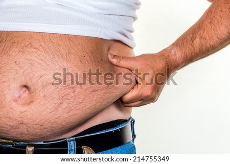 man with overweight. symbol photo for beer belly, unsuccessful diets and poor diet.