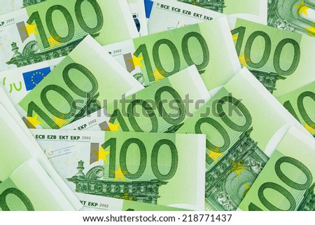 many einhhundert euro banknotes lie side by side. symbol photo for wealth and investment