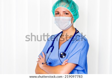 a nurse or doctor in surgical clothes before surgery. symbol photo for work in the hospital