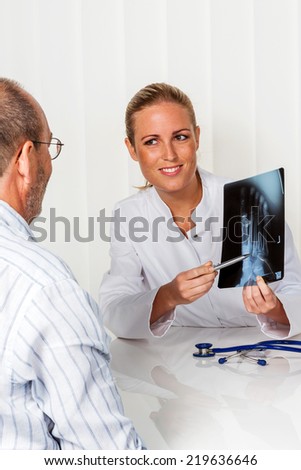patient and doctor talking on the advice of the doctor\'s office. orthopedist in the discussion of findings