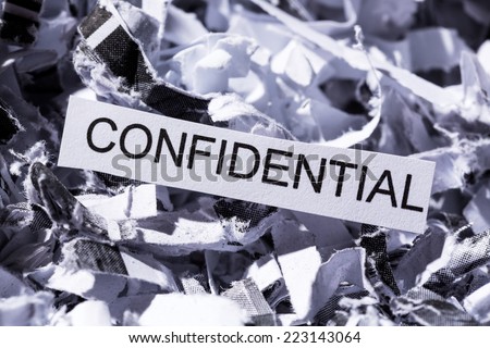 scraps of paper with the heading confidential, symbol photo for data destruction, banking secrecy and confidentiality