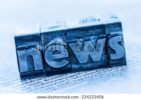 the word news written with lead letters. symbol photo for newsletters, newspapers and information