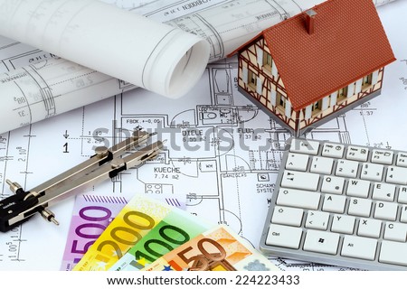 an architect\'s blueprint with euro money. symbol photo for financing and planning of a new home.