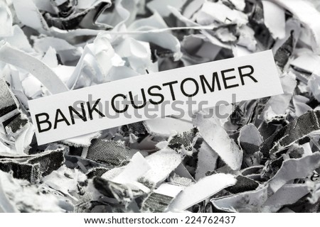 shredded paper tagged with bank customer, symbol photo for data destruction, customer data and bank secrecy