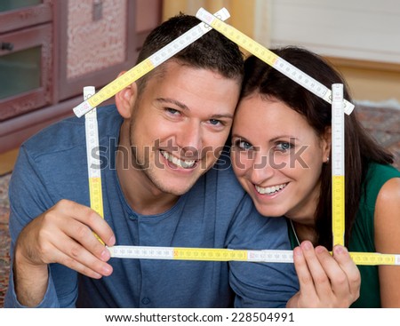 a young couple is looking forward to the construction of a detached house